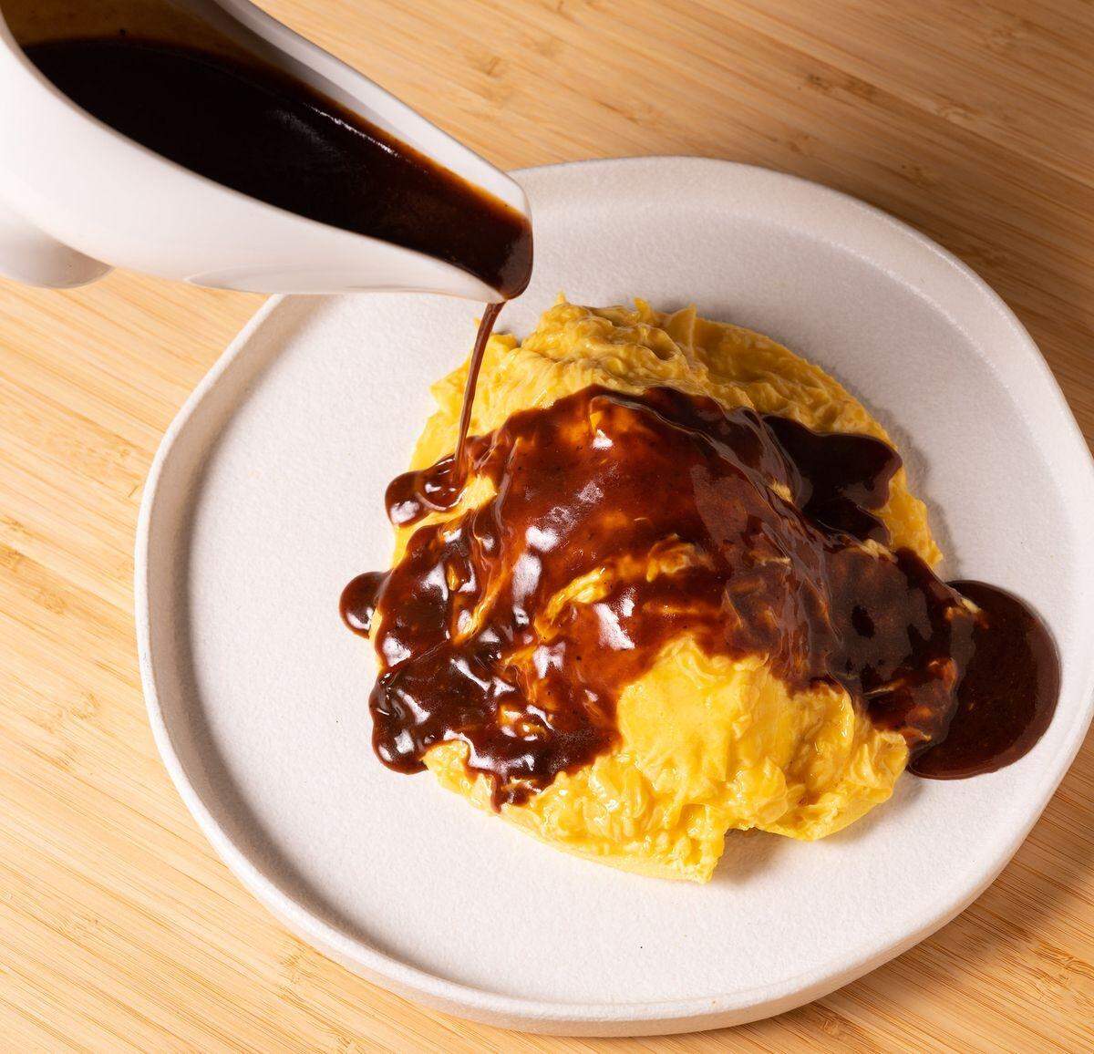 A dramatic dish at the soon-to-open is called omurice and is made with eight eggs.
