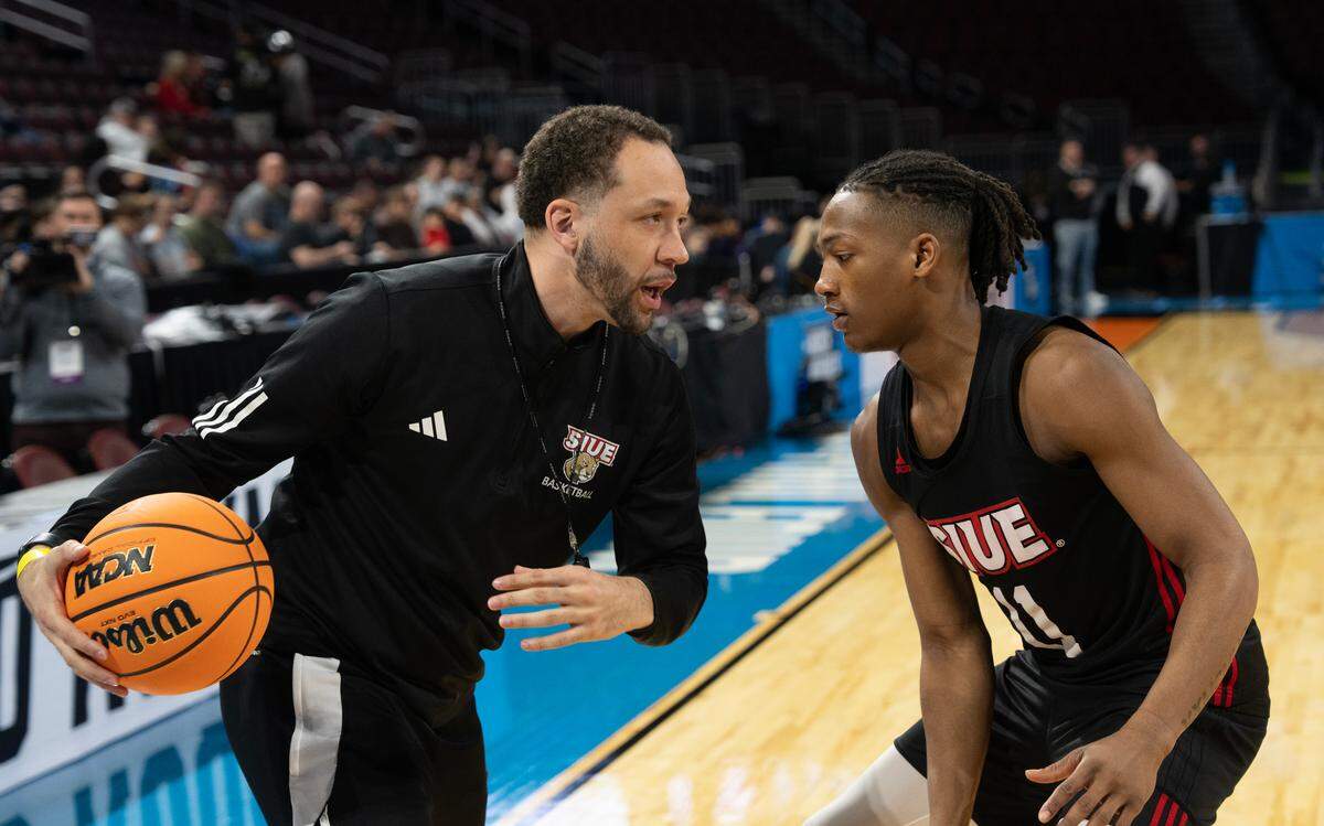 SIU Edwardsville assistant coach Jay Bradley works with player Brian Taylor II during an open practice at the 2025 NCAA Division I Men’s Basketball Championship at INTRUST Bank Arena. SIU Edwardsville faces Houston in the first round on Thursday. Bradley is a Wichita native chasing his coaching dream.