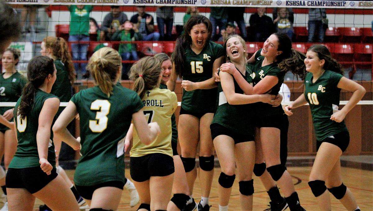 Bishop Carroll’s Riley Daugherty (second right) and Ella Larkin (third right) were chosen to the Class 5A All-Tournament volleyball team in 2018.
