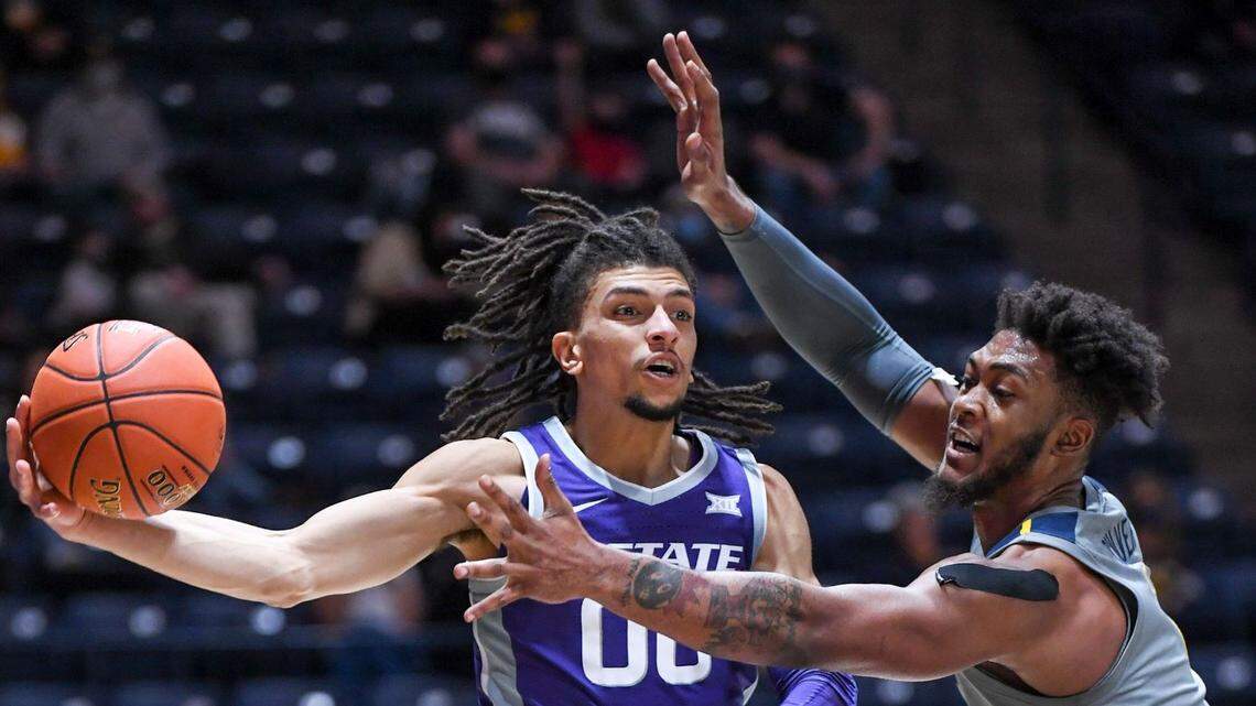 Kansas State guard Mike McGuirl looks to pass against West Virginia forward Derek Culver.