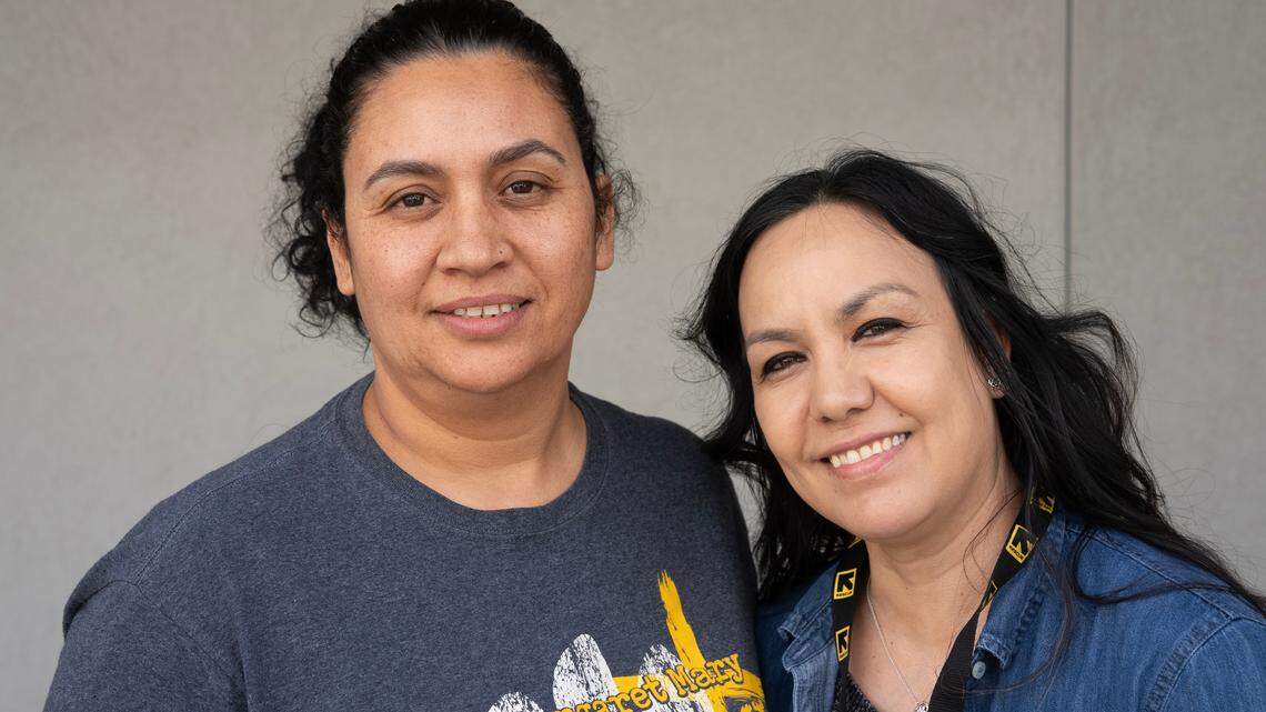 Veronica Rendon, left, with Adriana Nava, family services coordinator at International Rescue Committee.