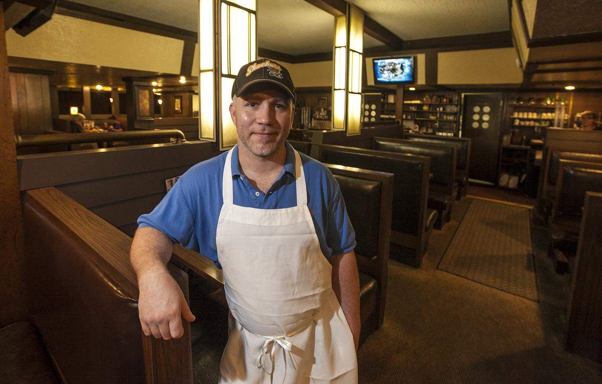Brian Scott is pictured inside Doc’s Steak House in 2014 when he announced that he would close the restaurant.