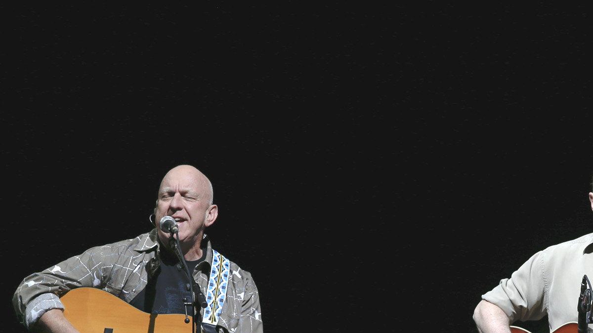 The Eagles perform during their "History of the Eagles" tour at Intrust Bank Arena. Left to right is Bernie Leadon, Don Henley and Glenn Frey. (October 7, 2013)
