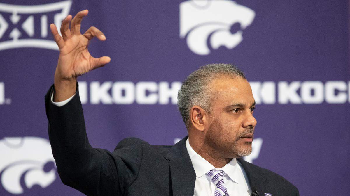 New Kansas State men’s basketball coach Jerome Tang holds up a Wildcat hand symbol during his introductory news conference at Bramlage Coliseum in Manhattan on Thursday. Tang, a long time assistant at Baylor, replaces Bruce Weber, who resigned recently following a string of disappointing seasons.