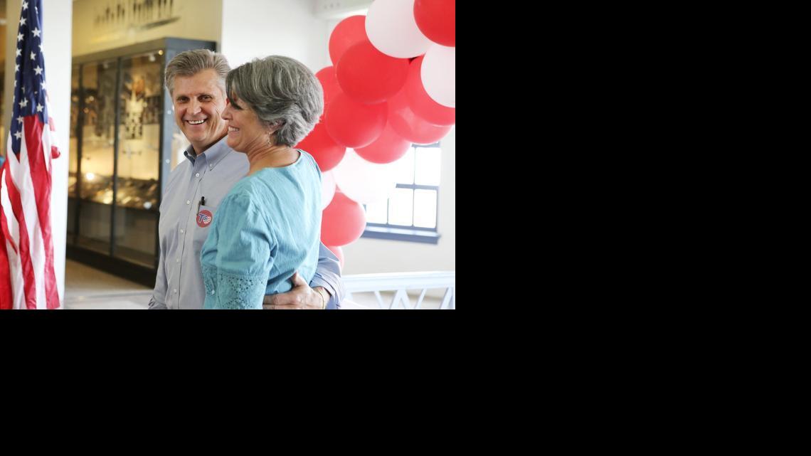 Former congressman Todd Tiahrt and his wife, Vicki, hug after he announced at the Kansas Aviation Museum that he's running for the 4th District, which he represented in the House for eight terms. The race in the Aug. 5 primary will pit him against fellow Republican Mike Pompeo, who replaced Tiahrt in 2011. (May 29, 2014)


