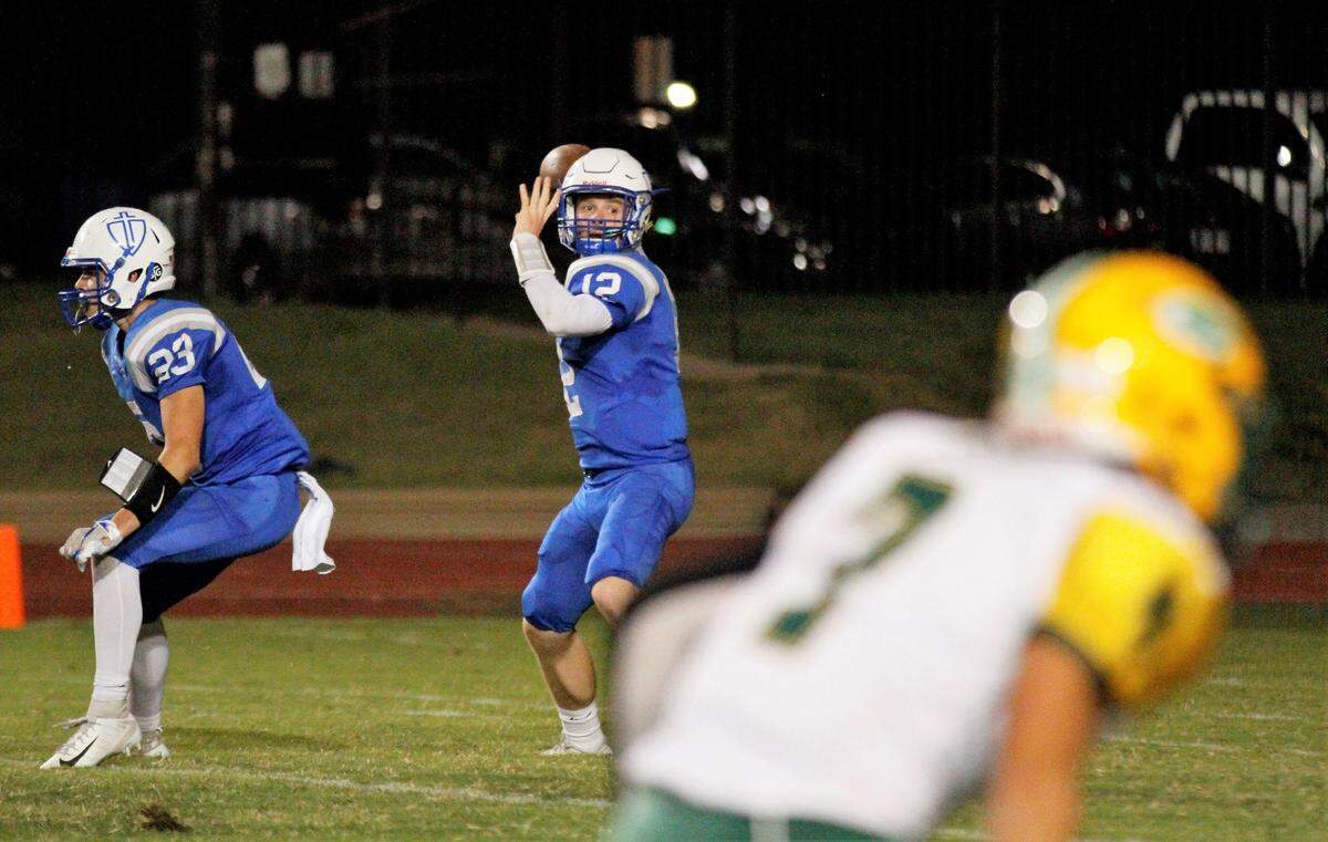 Kapaun senior quarterback Jack Hacking looks to fire against Bishop Carroll during the Golden Eagles’ 28-14 win at Kapaun on Friday. (Oct. 5, 2018)