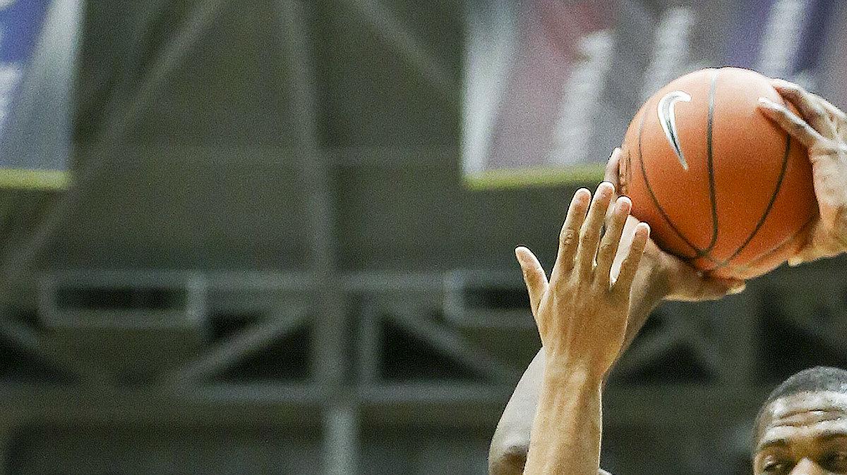 Wichita State's Kadeem Coleby (20)  pulls down a rebound against Evansville's Jaylon Brown (3) and Duane Gibson (4) in the second half  at Koch Arena Saturday. (Feb. 1, 2014)