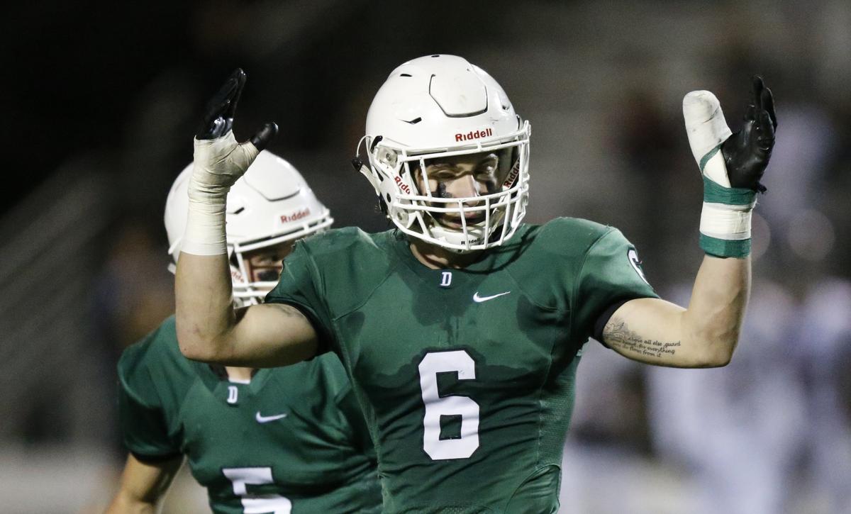 Derby place kicker Jackson Syring celebrates after kicking field goal in the 1st quarter Friday night against Manhattan.  (November 16, 2018)