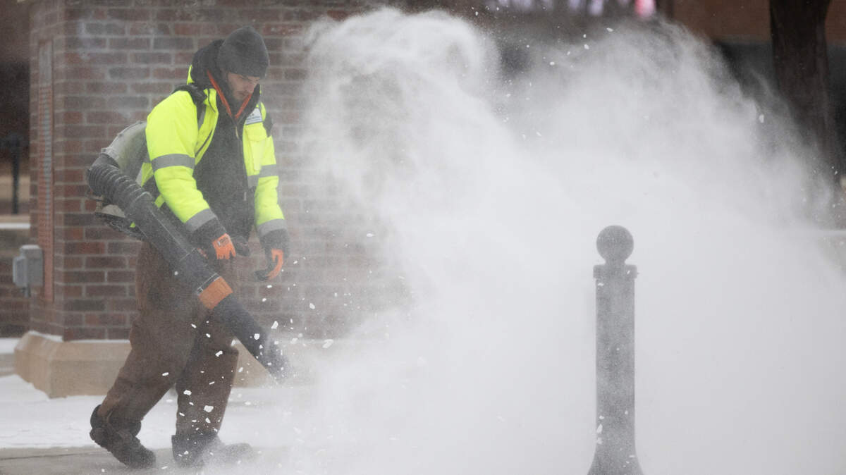 Snow removal crews were hard at work across downtown Wichita on Tuesday morning as temperatures hovered just above zero and wind chills were around -13 degrees. More snow is expected through the day.