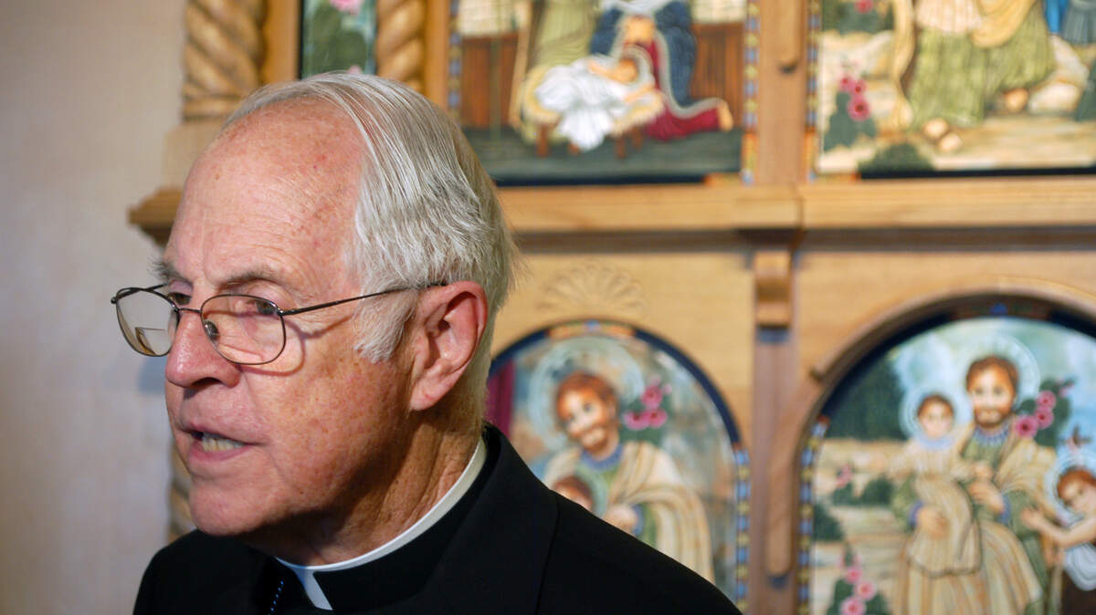 In this 2014 file photo, former Archbishop Michael Sheehan talks to reporters at St. Joseph Community Health in Albuquerque, N.M. Sheehan, who was born in Wichita, has died at 83.