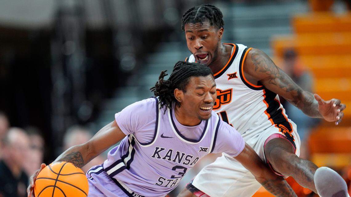 Kansas State Wildcats guard C.J. Jones (3) goes past Oklahoma State Cowboys guard Davonte Davis (4) during a basketball game at Gallagher-Iba Arena in Stillwater, Okla., Tuesday, Jan. 7, 2025.