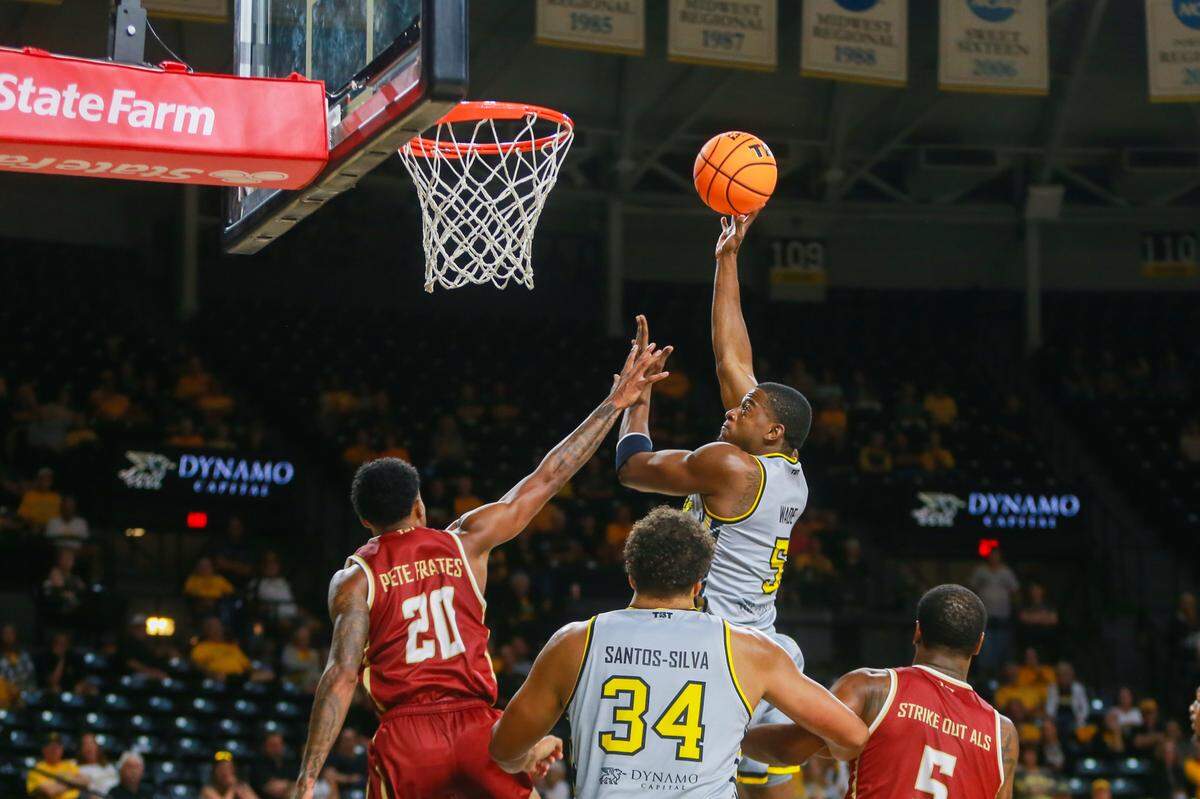 Small Forward Trey Wade tips the ball in for a basket during the AfterShocks’ game against Team Challenge ALS on July 20.
