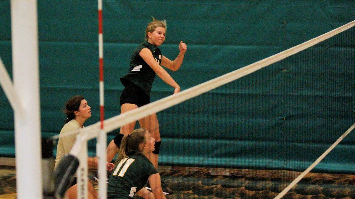 Carroll sophomore outside hitter Ella Larkin spikes the ball during the Golden Eagles’ triangular with Kapaun Mt. Carmel and Wichita East on Tuesday. (Sept. 4, 2018)