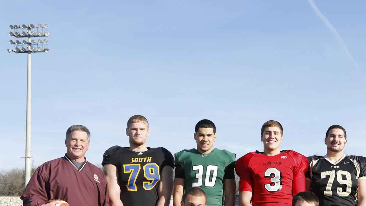 2013 Top 11 football team front row Buhler's Riley Allen, Silver Lake's Dailin Kruger, Derby's Jose Delgado and Gardner-Edgerton's Trae Wrench, Back row: Buhler Caoch Steve Warner, Olathe South's Braden Smith, Derby's DeAndre Goolsby, Blue Valley West's Ryan Ralston, Blue Valley's AJ Harris, Salina South's Zach Nachbar, Hiawatha's Petyon Newell and Bishop Miege's Brad Ivey. (December 3, 2013)
