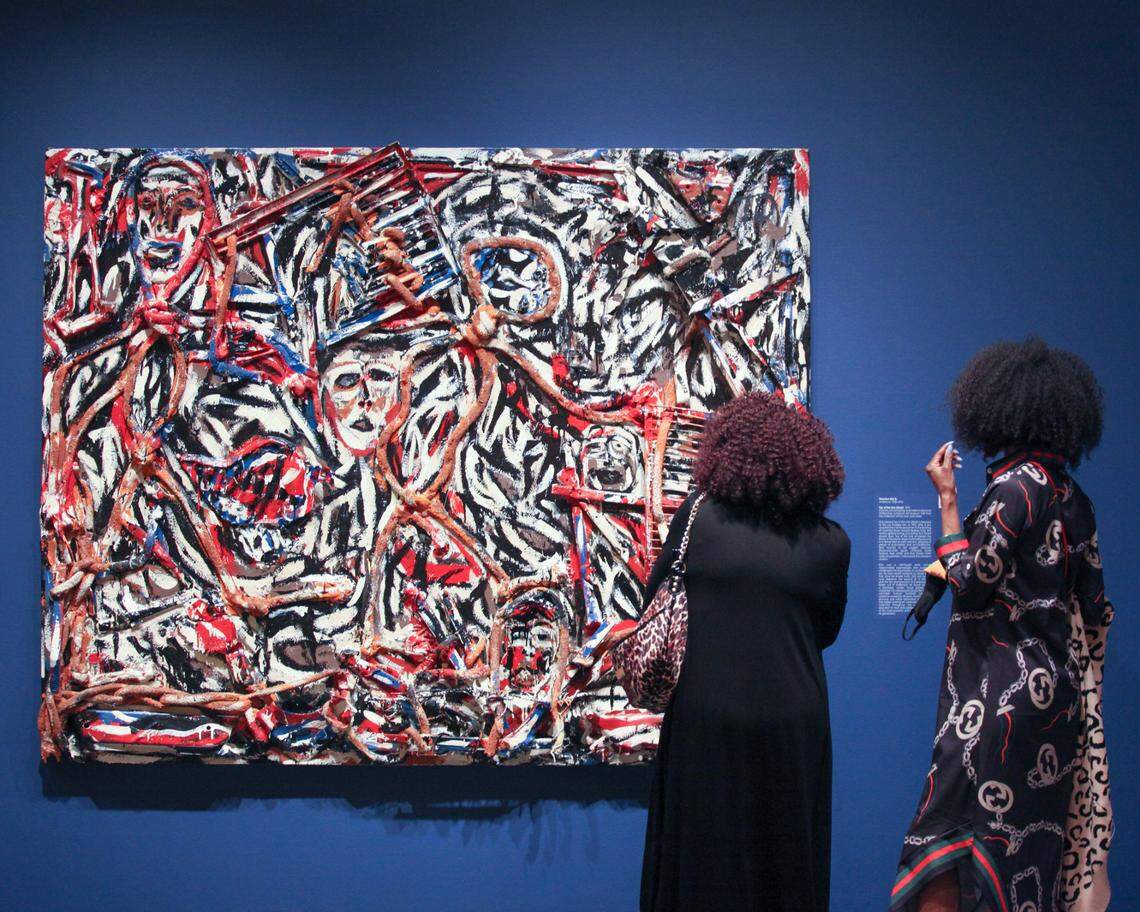 Wichita Art Museum visitors look at Thornton Dial Sr.’s 1992 piece titled “Top of the Line (Steel).” The mixed media piece was on view during the exhibition African American Art in the 20th Century: Harlem Renaissance, Civil Rights Era, and Beyond. The show, organized by the Smithsonian American Art Museum, was on view at WAM in 2021.