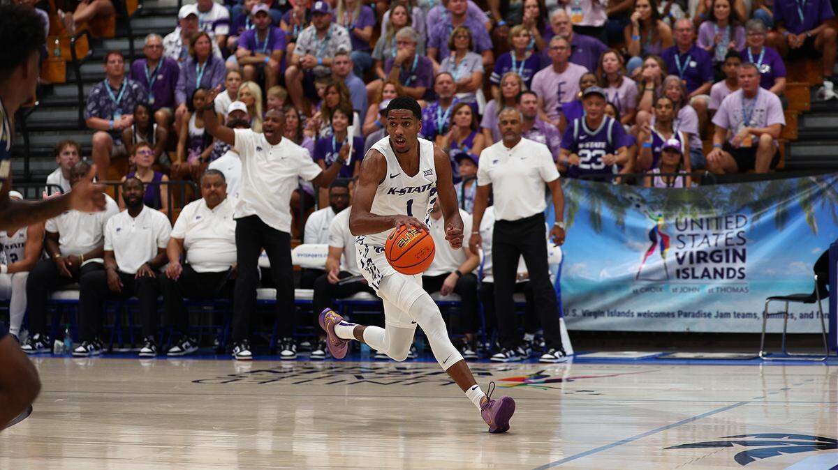 Kansas State basketball player David N’Guessan dribbles up court against George Washington at the Paradise Jam.