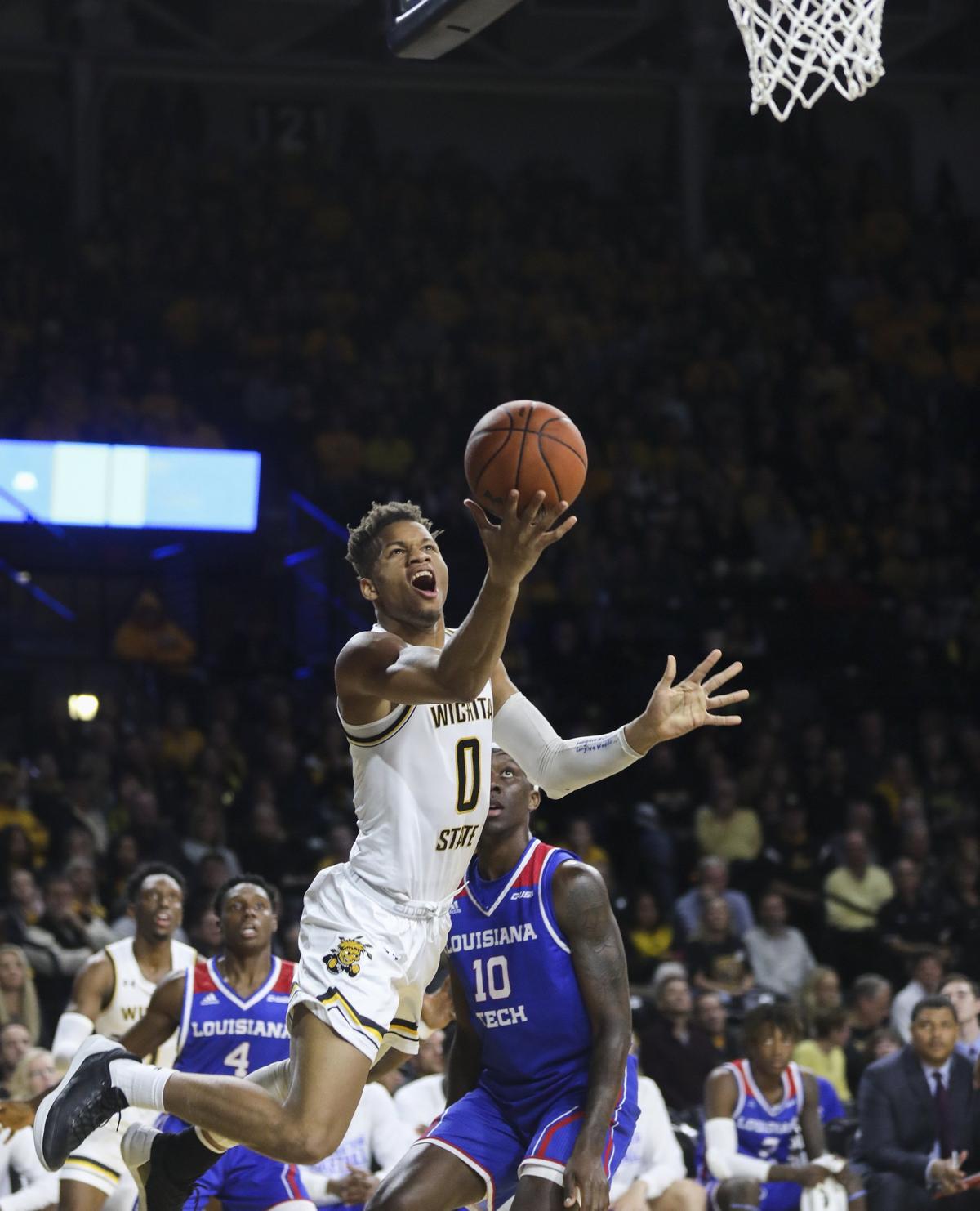 Wichita State guard Dexter Dennis drives to the basket during the first half of the game against Louisiana Tech Bulldogs on Tuesday in Koch Arena.