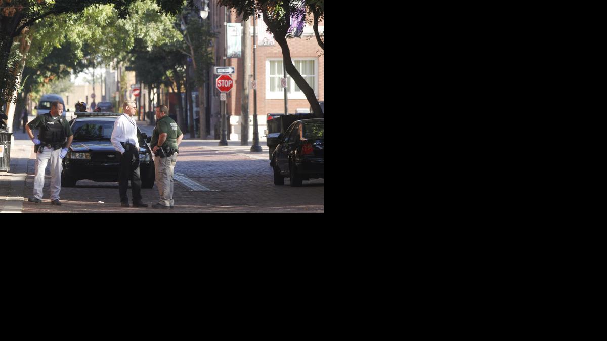 Wichita police investigate the scene of a shooting in Old Town early Sunday morning. This is in the 100 block of Rock Island.(Sept. 22, 2013)

