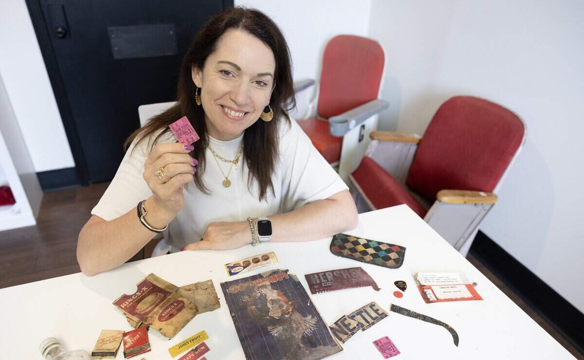 Stacee Olden, executive director of the Orpheum Theatre, holds up a ticket stub from the Kansas premiere of “Gone With the Wind” that the theater hosted in February of 1940. The ticket stubs, and several other old items, were discovered during the theater's restoration process over the last year.