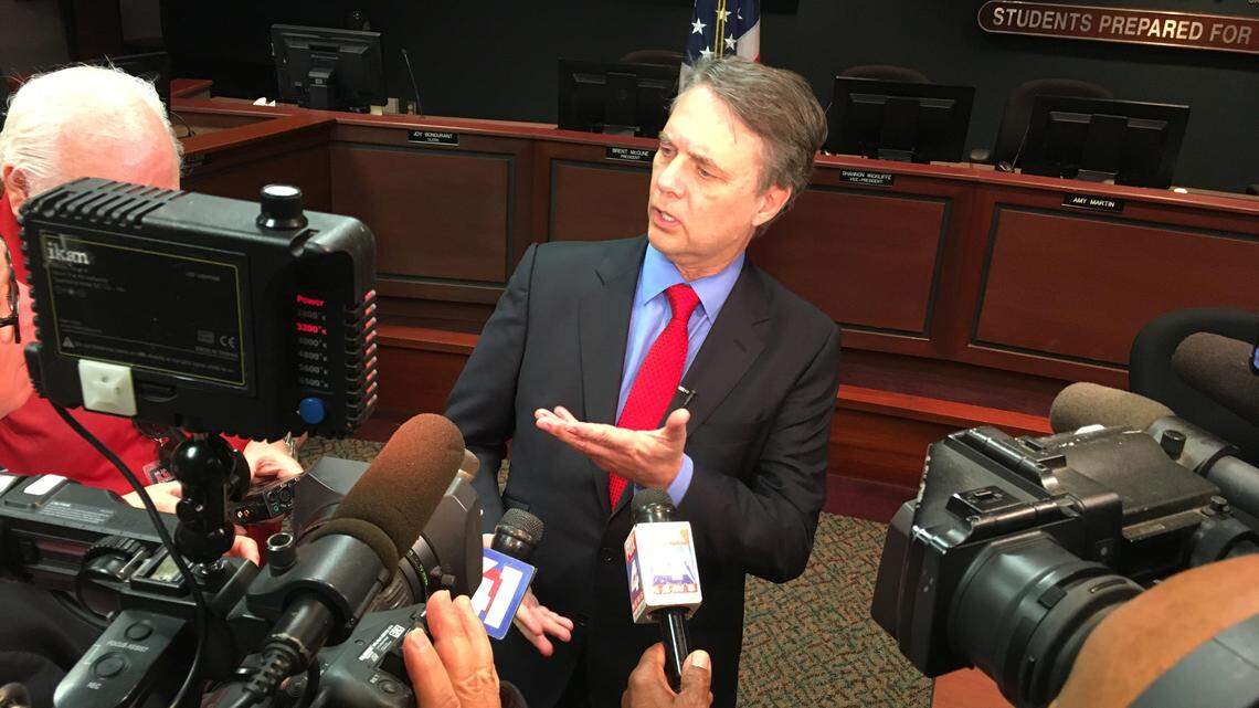 Gov. Jeff Colyer speaks to reporters after signing a bill Monday to fix an $80 million error in a new school funding law.