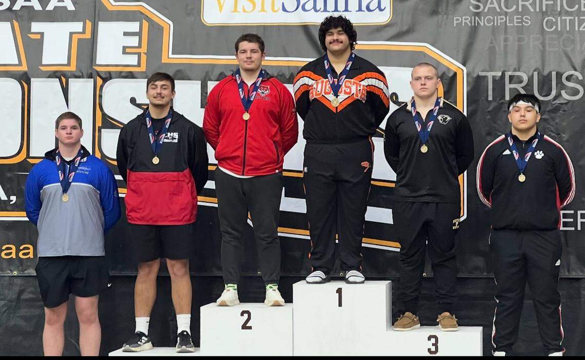 Augusta senior Willy Jon Morales stands on top of the podium after winning the heavyweight championship at the Class 4A state tournament in Salina earlier this month.
