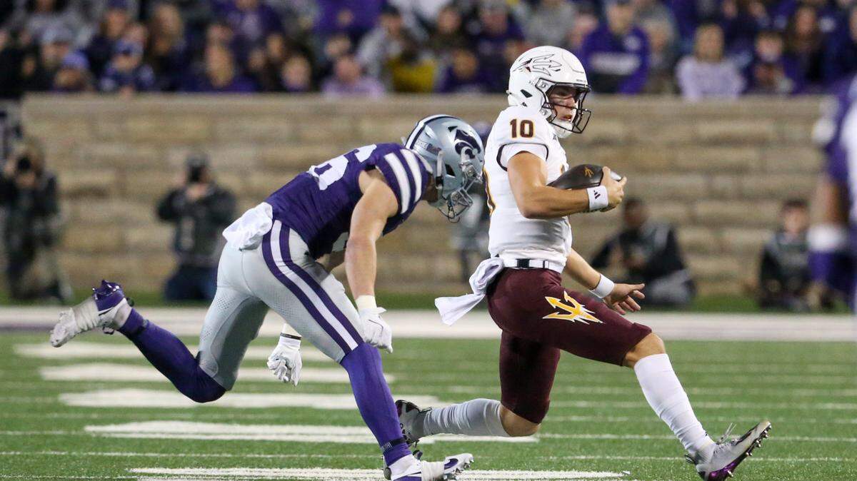Kansas State Wildcats safety Jack Fabris chases Arizona State Sun Devils quarterback Sam Leavitt during the first quarter at Bill Snyder Family Football Stadium on Nov. 16, 2024.