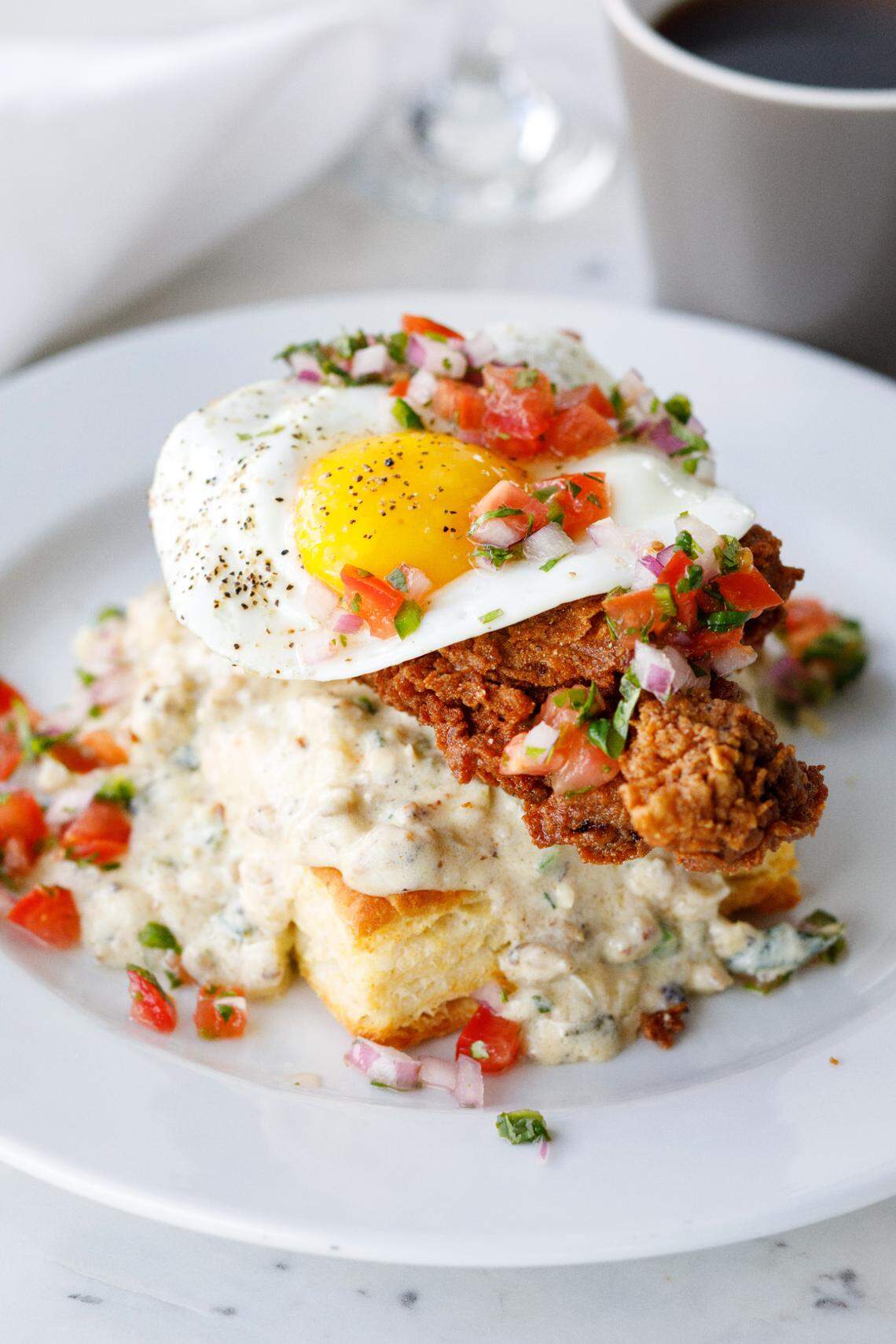 The biscuits and gravy at Larcher’s Market feature poblano gravy, pico de gallo and fried chicken.