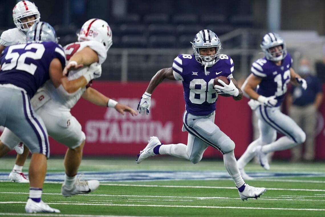 Stanford linebacker Duke Reeder (52) helps defend as Kansas State wide receiver Phillip Brooks (88) returns a punt in the first half of an NCAA college football game against Stanford in Arlington, Texas, Saturday, Sept. 4, 2021. (AP Photo/Tony Gutierrez)