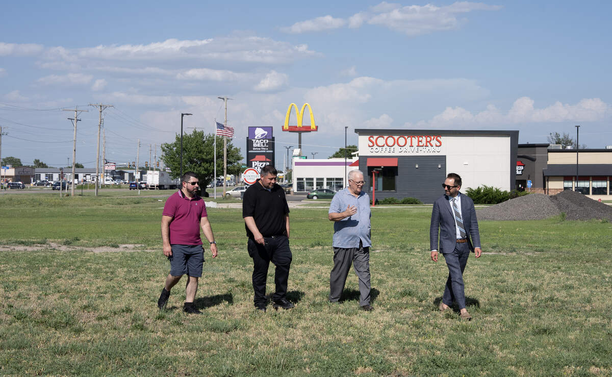 Paradise Corner will be the first new mixed-use commercial building to be built in Goddard since 1998. Left to right: Jesus Valencia, general manager of El Agave; Ruben Melgoza, also with El Agave; Goddard Mayor George Liebe; and Steven Suellentrop, president and CEO of Legacy Bank.
