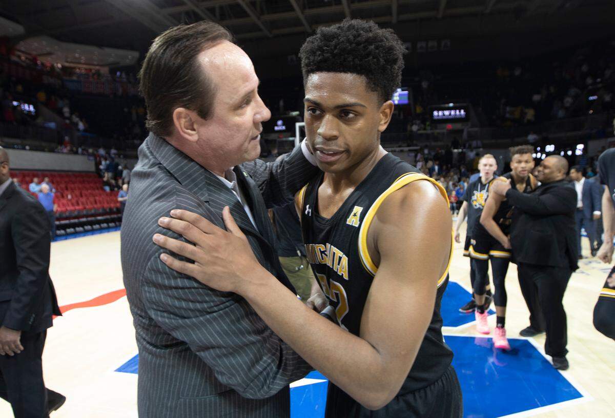 Wichita State coach Gregg Marshall congratulates Grant Sherfield after the Shockers completed a dramatic comeback after being down 24 to SMU in the second half. Wichita State won 66-62.
