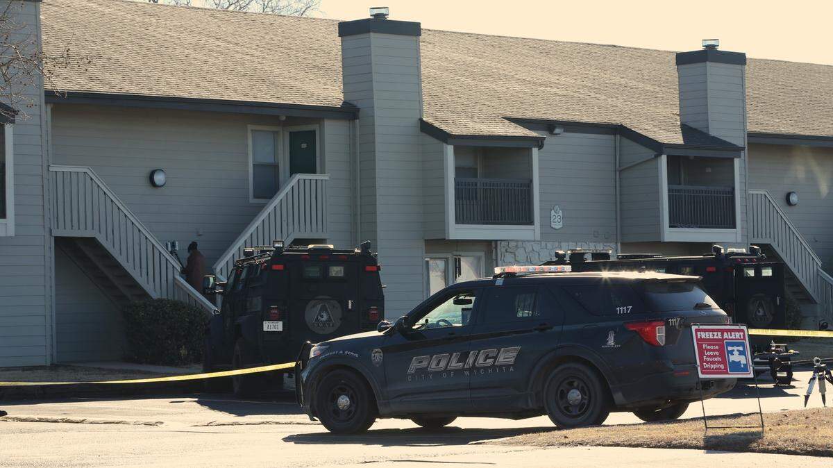 Police investigators were at an apartment complex in west Wichita Monday after a hours-long standoff. A woman is accused of shooting and killing her 14-year-old son.