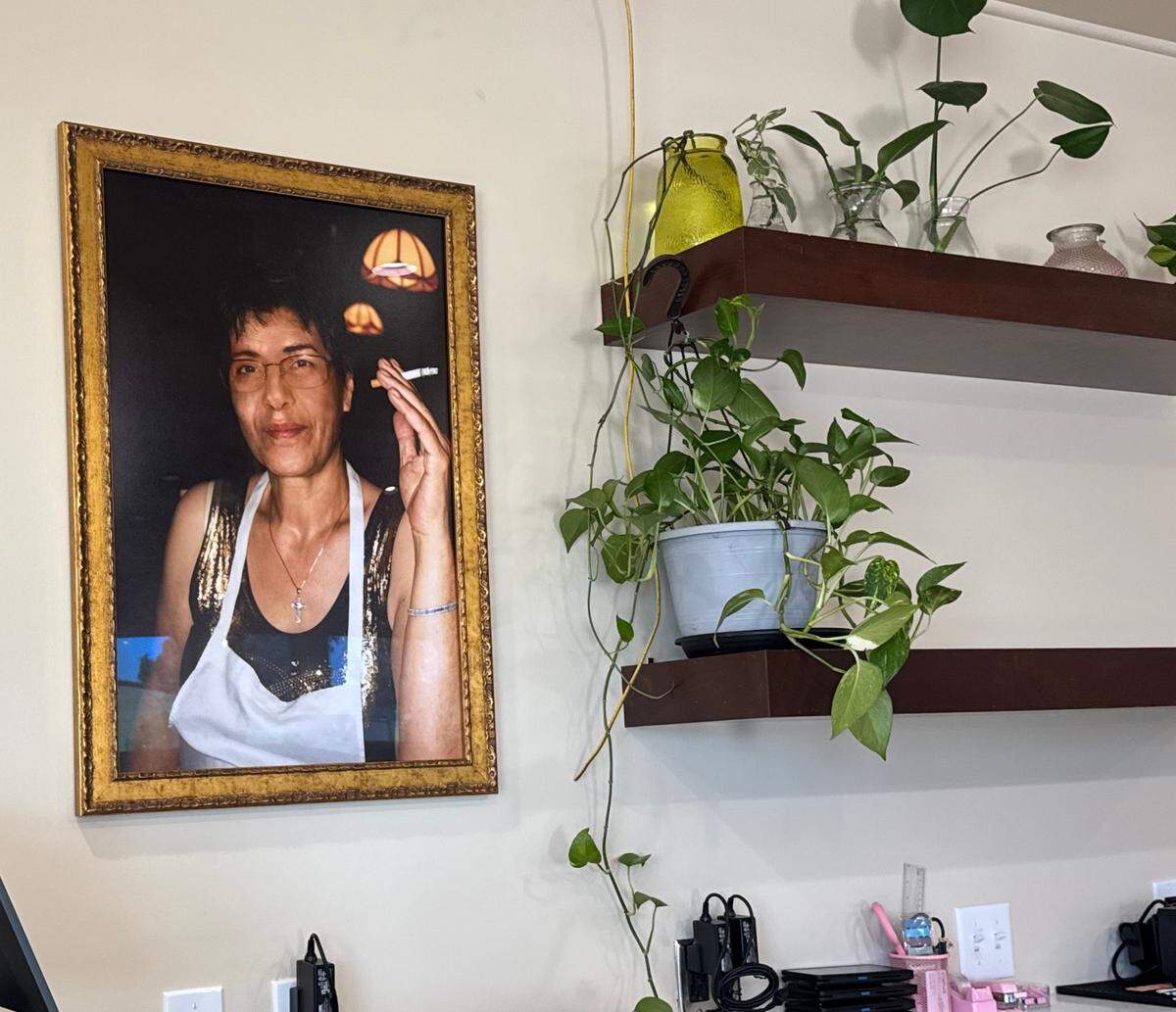 N&J Cafe owners Nick and John Srour have hung a favorite photo of their mother, Mona, by the restaurant’s register.