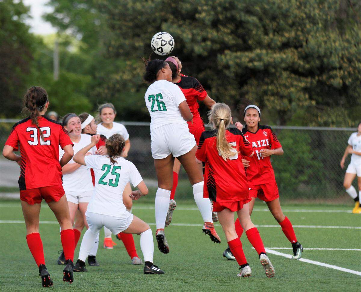Derby’s Reagan Stiger goes up for a header.