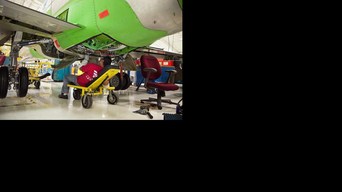 A Bombardier Learjet employee works on the Model 70/75 production line.

