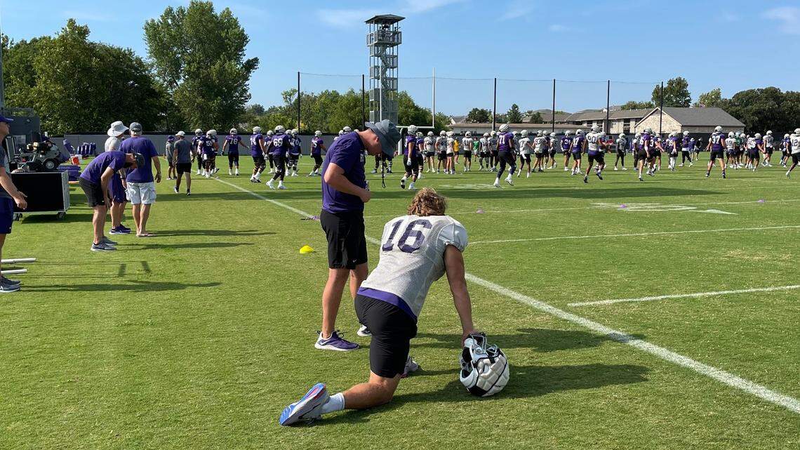 Kansas State linebacker Will Honas takes a knee at the start of a Wildcats football practice.