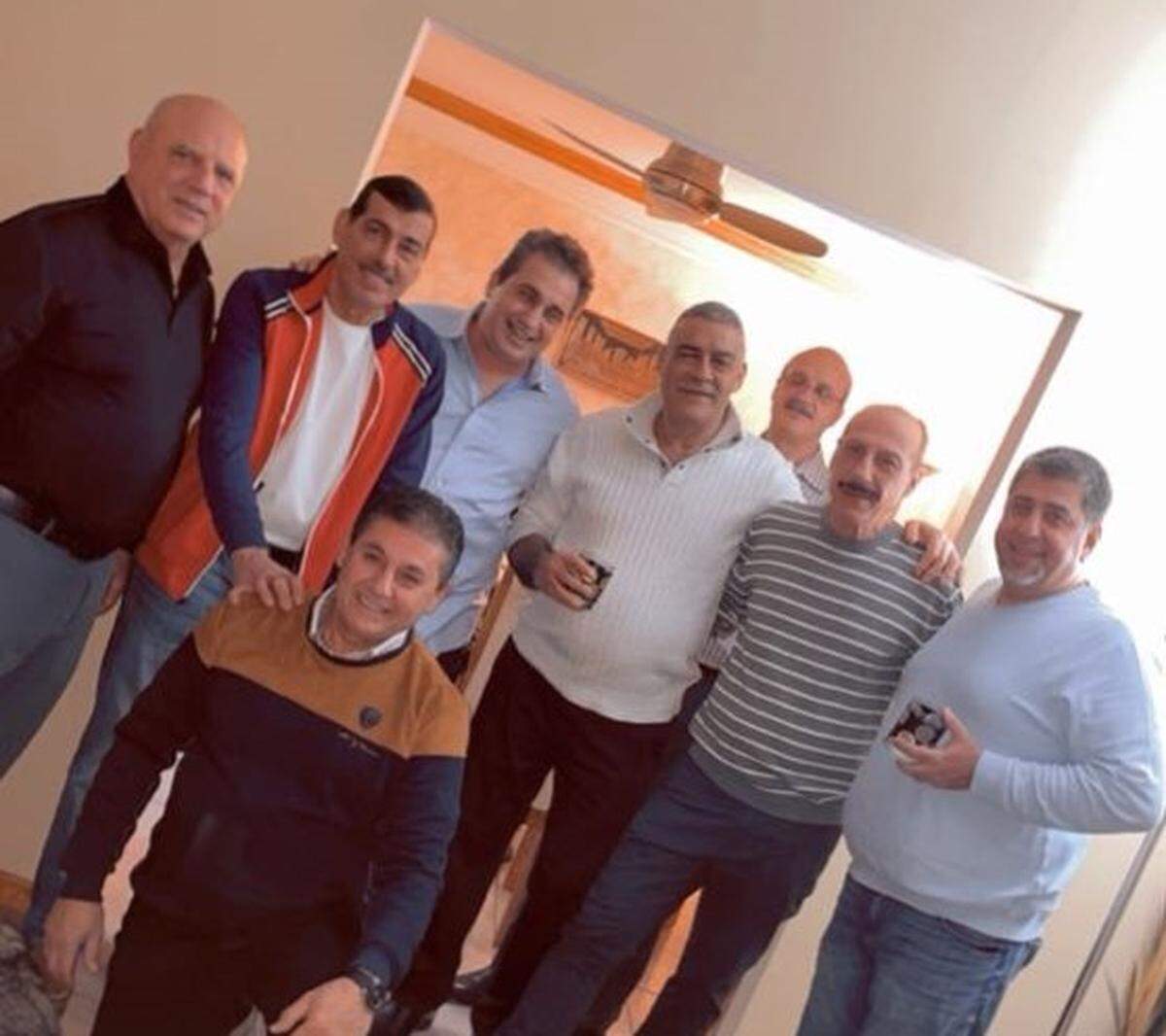 Hani Sami Stefan (kneeling) visiting with cousins and other family.