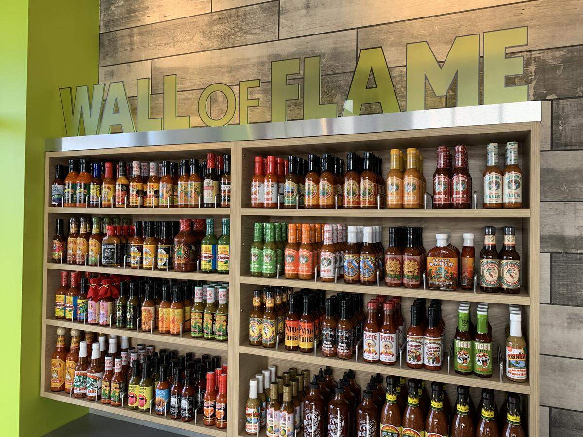The Wall of Flame features 75 different hot sauces that customers at California Tortilla can use and return.