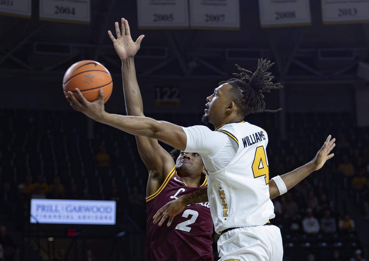 Wichita State’s T.J. Williams goes up for a shot during the first half of their game against Loyola at Koch Arena on Thursday.