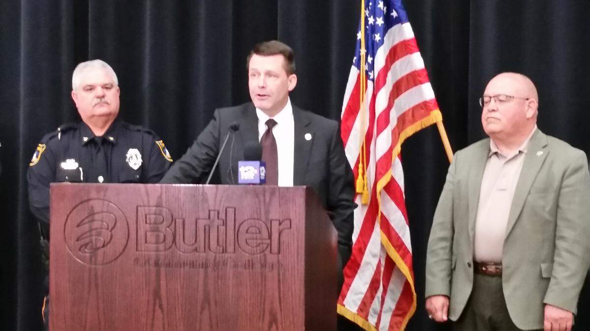Special Agent in Charge Darrin Jones speaks at Butler Community College on Wednesday about the FBI's child abduction training, which includes 33 Kansas law enforcement agencies. He was joined at the podium by Topeka Police Chief Bill Cochran, left, and Butler County Sheriff Kelly Herzet, right.