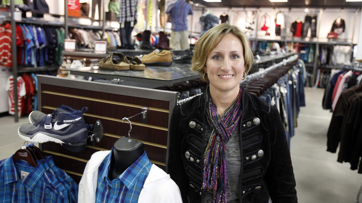Uptown Cheapskate owner Mollie Schell, shown in a 2010 file photo from when she opened her west-side store, is opening a second one at the Shops at Tallgrass.