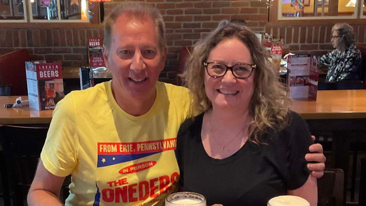 Joel Light, left, is pictured at Old Chicago. He’s just completed 180 World Beer Tours at the restaurant, meaning he’s sampled around 20,000 beers.