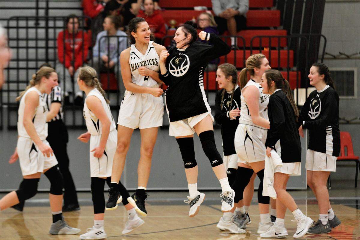 Maize South’s Lauren Johnson (left) and Addie Timmer (right) jump in celebration during the Mavericks’ emphatic 67-17 win over Mill Valley in the 2019 Lady Cat Classic in El Dorado on Saturday night. (Jan. 26, 2019)