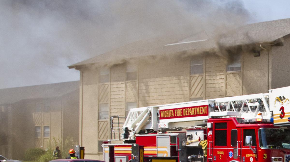 Wichita firefighters battle a blaze at High Point East Apartments, 9400 E. Lincoln Thursday, Aug. 25, 2011. Multiple fire units were called to the fire near Lincoln and Webb road and quickly moved into a defensive mode to get the flames under control before firefighters could enter the building.