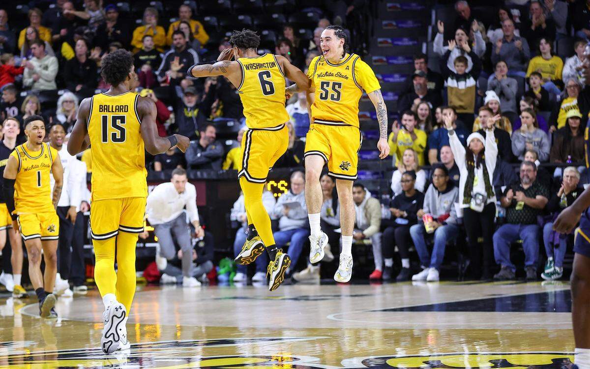 Corey Washington and Bijan Cortes celebrate a big play in Wichita State’s win over East Tennessee State at Koch Arena.