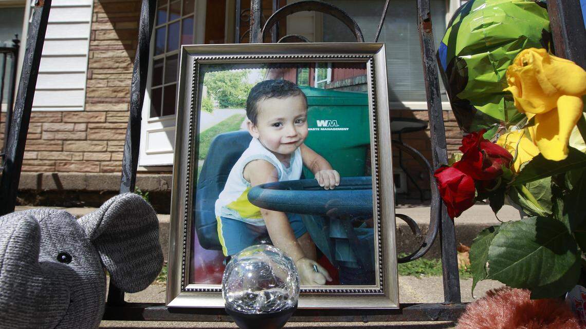 A memorial to three-year-old Evan Brewer sits in front of the house at 2037 S. Vine in September after his body was found.