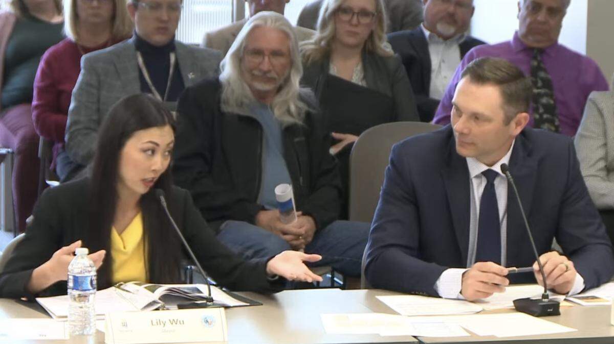 Wichita Mayor Lily Wu and Sedgwick County Commission Chair Ryan Baty sit next to other at a joint meeting on April 4, 2024 where City Council and County Commission members discussed potential opportunities to consolidate local government.