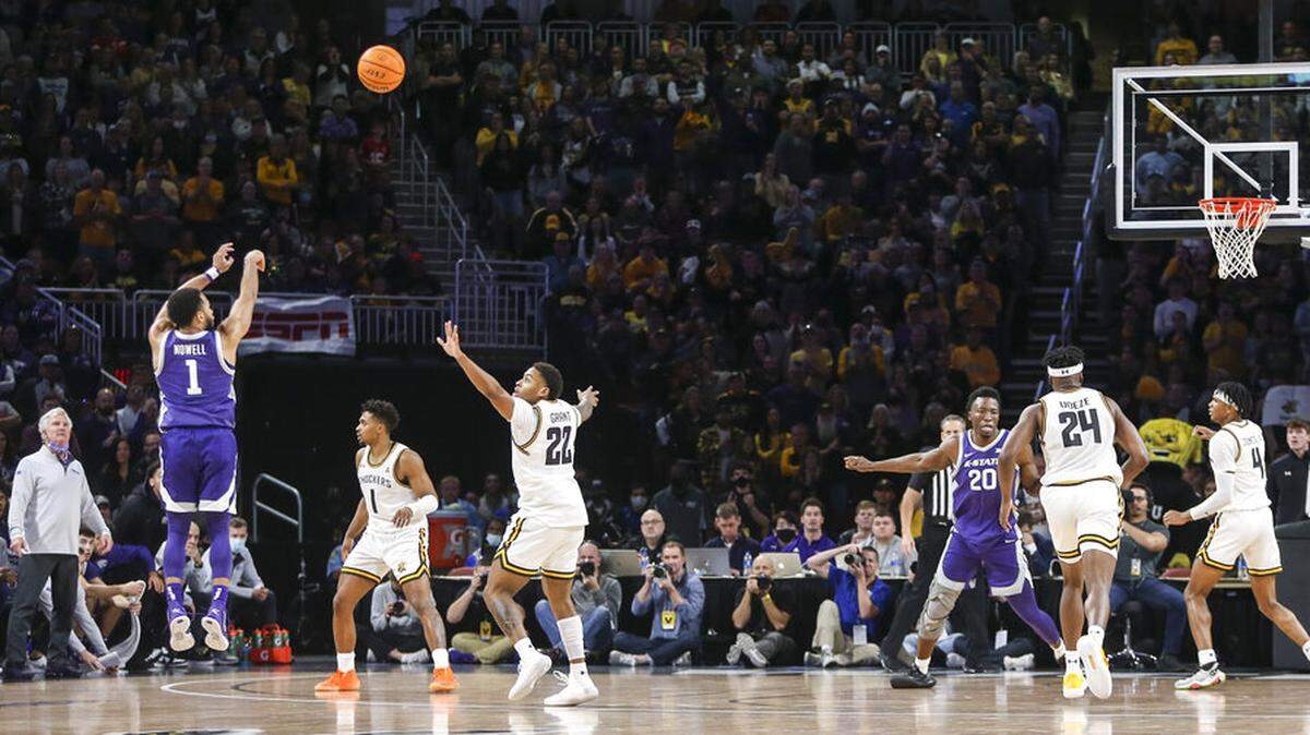 Kansas State’s Markquis Nowell hits a three-point basket in the second half of an NCAA college basketball game against Wichita State, Sunday, Dec. 5, 2021, in Wichita, Kan. (Travis Heying/The Wichita Eagle via AP)