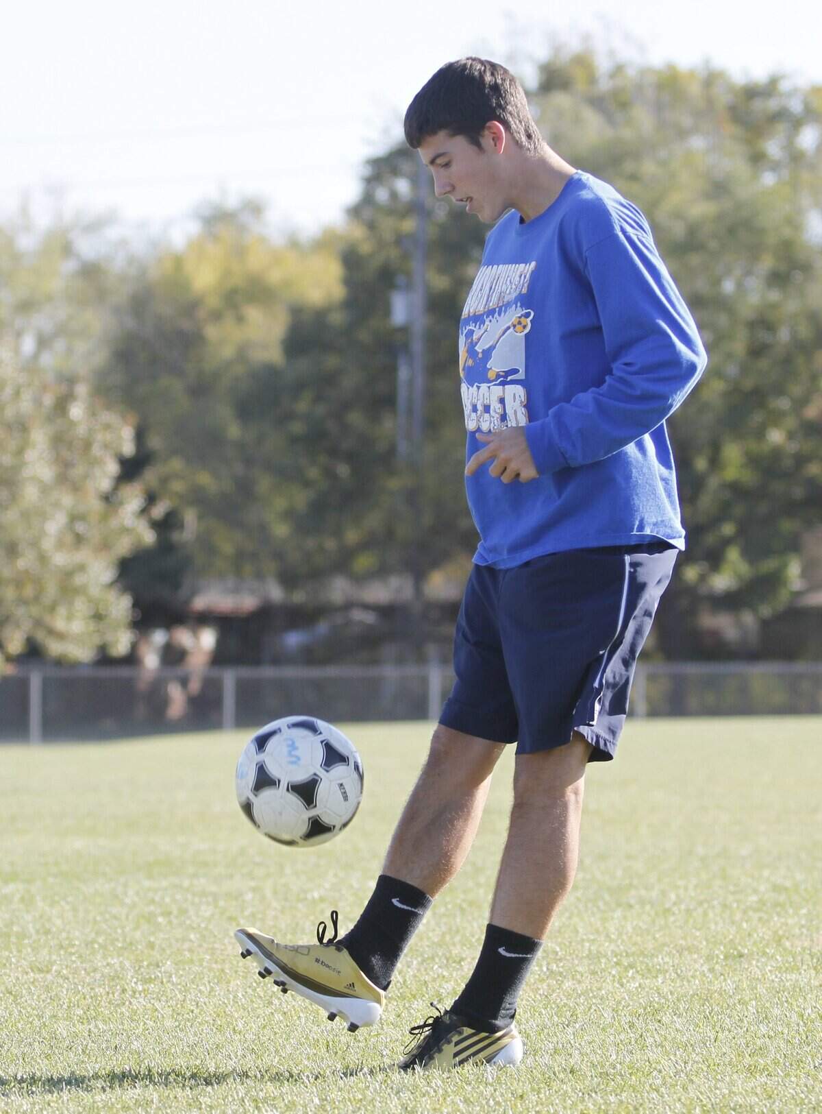 Northwest High School soccer player Austin Clifton dribbles the ball during practice. (October 31, 2011)