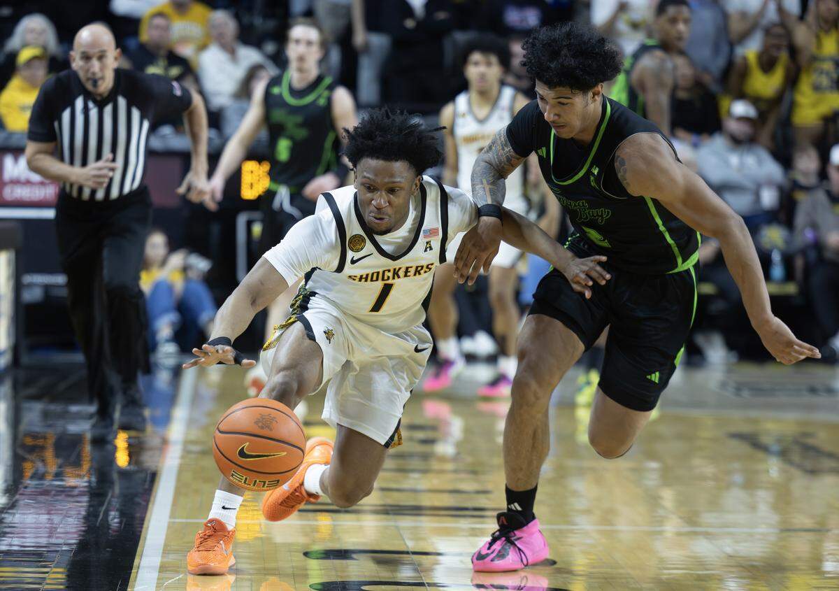 Wichita State’s Kenyon Giles steals the ball from South Florida’s Wes Enis during the second half at Koch Arena on Wednesday night.