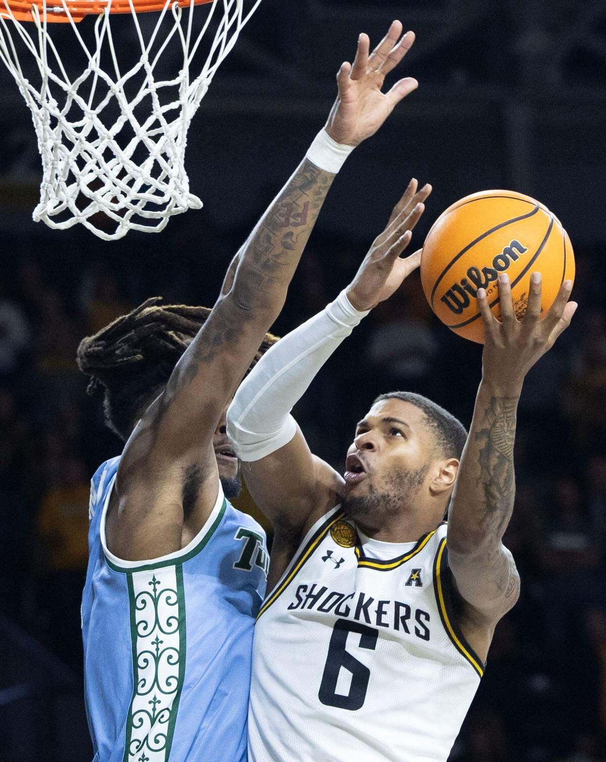 Wichita State’s Corey Washington goes to the basketball during the first half against Tulane on Sunday at Koch Arena.